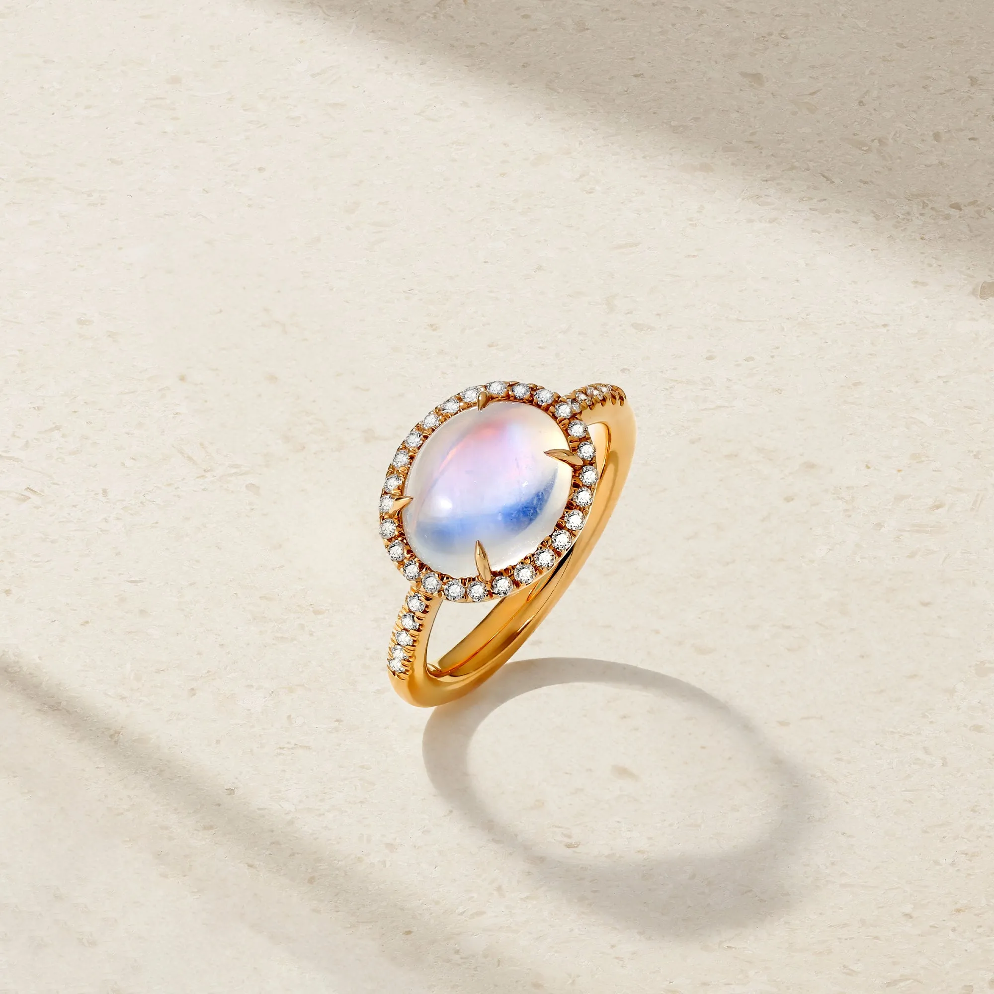 East-West Moonstone and Diamond Halo Ring