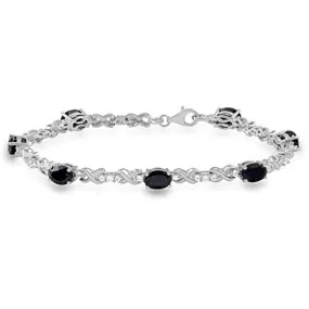 Jewelili Sterling Silver with 7 x 5 mm Oval Shape Onyx and Created White Sapphire Bracelet, 7.25"